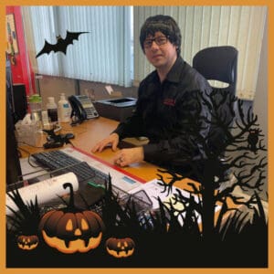 Team member at desk in halloween fancy dress in Wickford, Essex